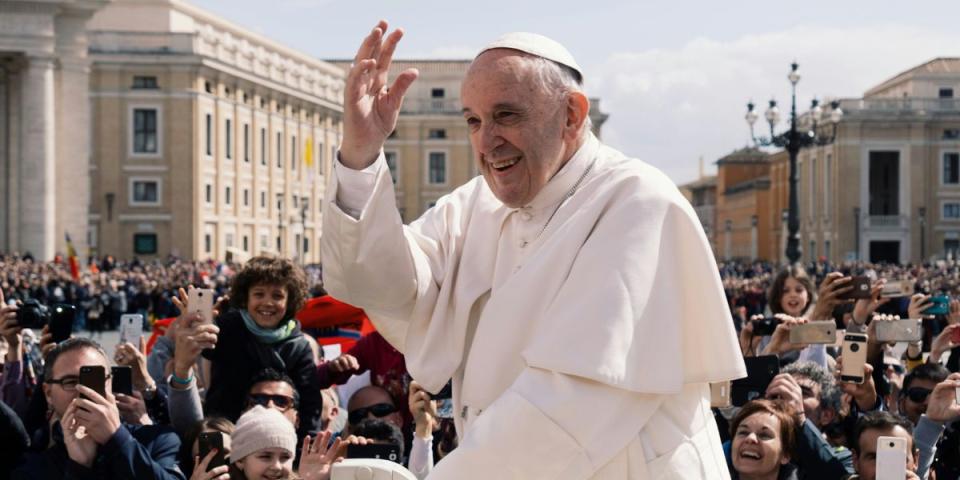 Pope Francis in open car travelling and greeting 