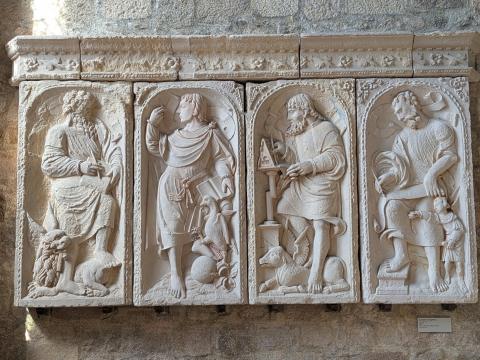marble carving of Apostles bias-relief on church wall 