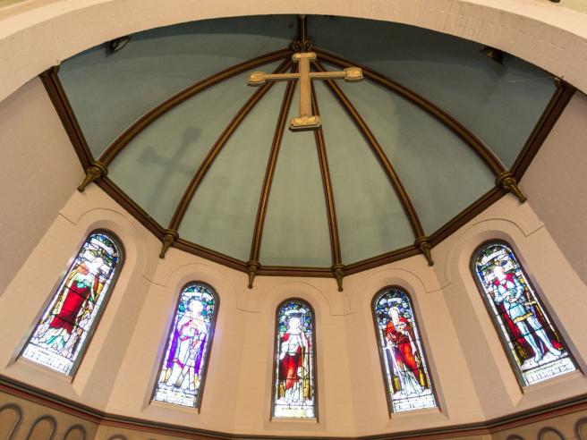 domed ceiling with hanging cross in Founders Chapel at Wycliffe College