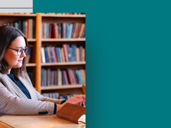 senior student Ellen Kelly in Cody Library typing on keyboard Jan 2025