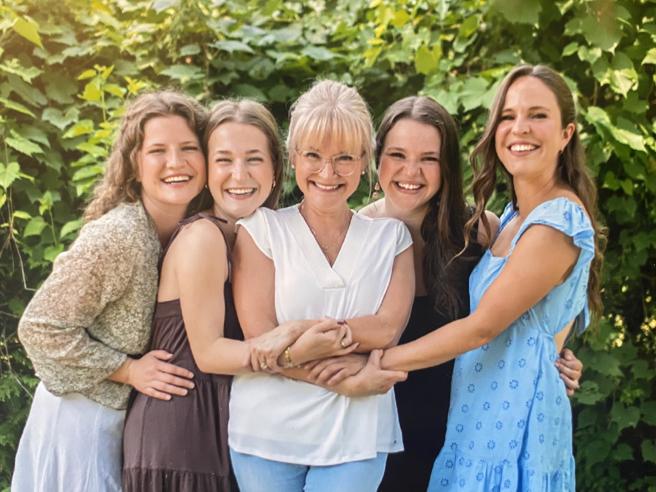 April McNeilly outdoors with her daughters 