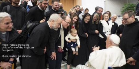 Pope Francis greets a baby - January 2025