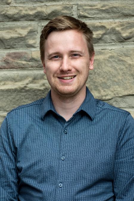 Nathan Konrad headshot outside of Great Hall September 2025