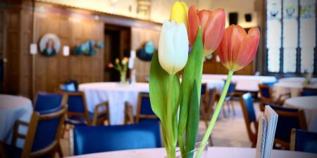 Spring 2025 women's breakfast: close up of tulips on table