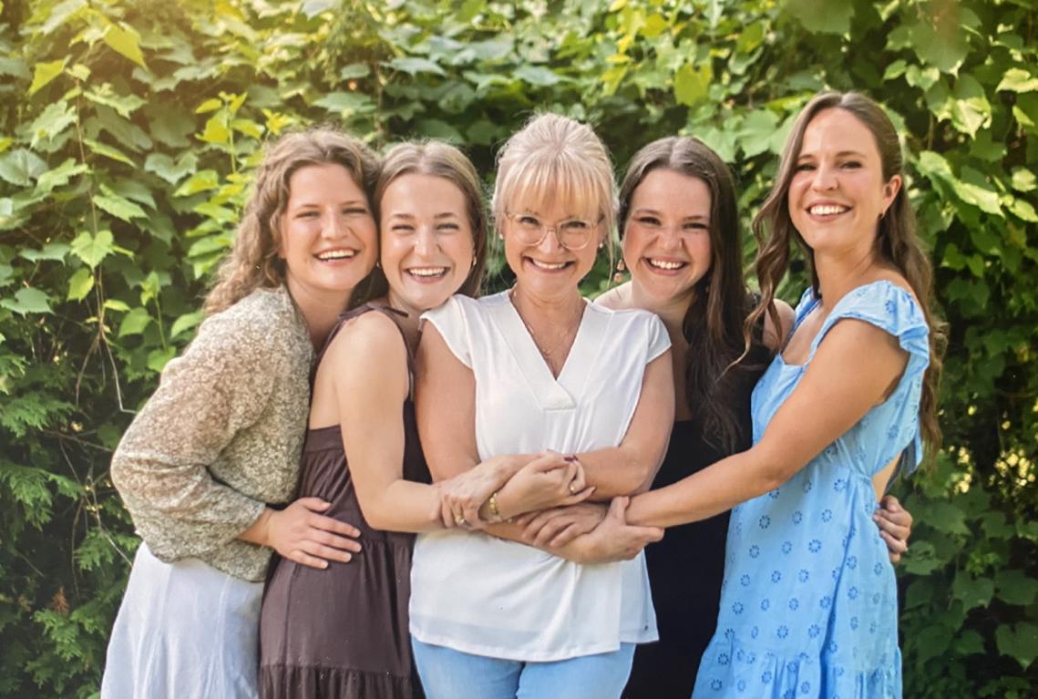 April McNeilly outdoors with her daughters 