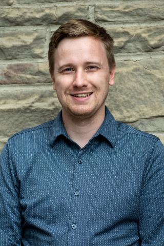 Nathan Konrad headshot outside of Great Hall September 2025