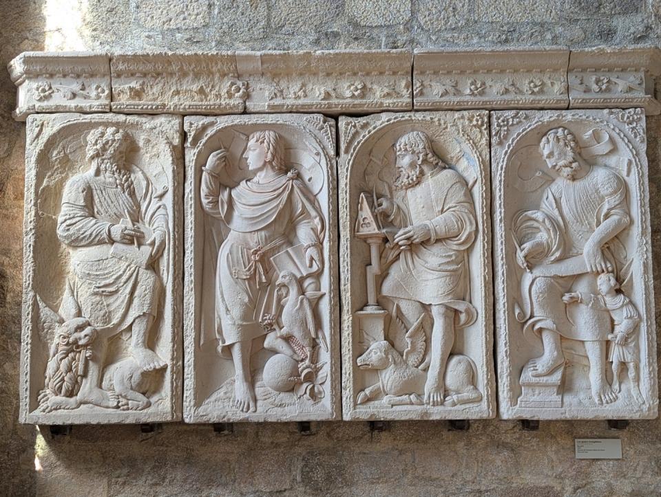 marble carving of Apostles bias-relief on church wall 